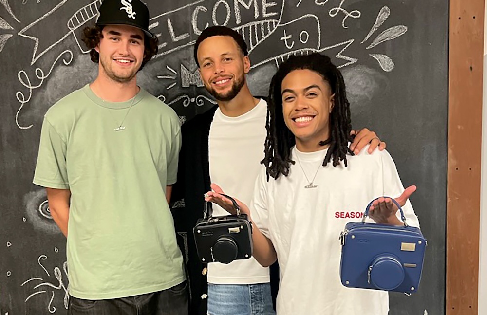 Keith Herron posing with Steph Curry